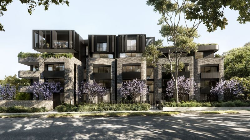 render of a pretty mid-rise building with multiple apartments, purple flowers and industrial brick and black facade.