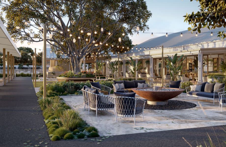 An outdoor area at a land lease community by Stockland. It has fire pits, festoon lights between luxury ammenities. 