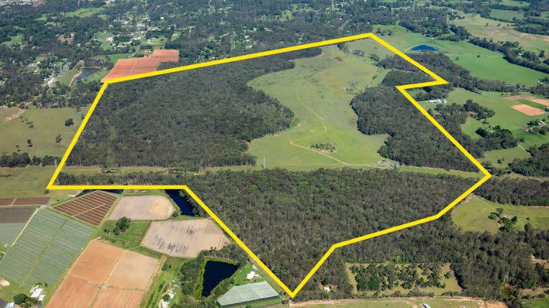 a large parcel of land in west caboolture with open spaces and trees