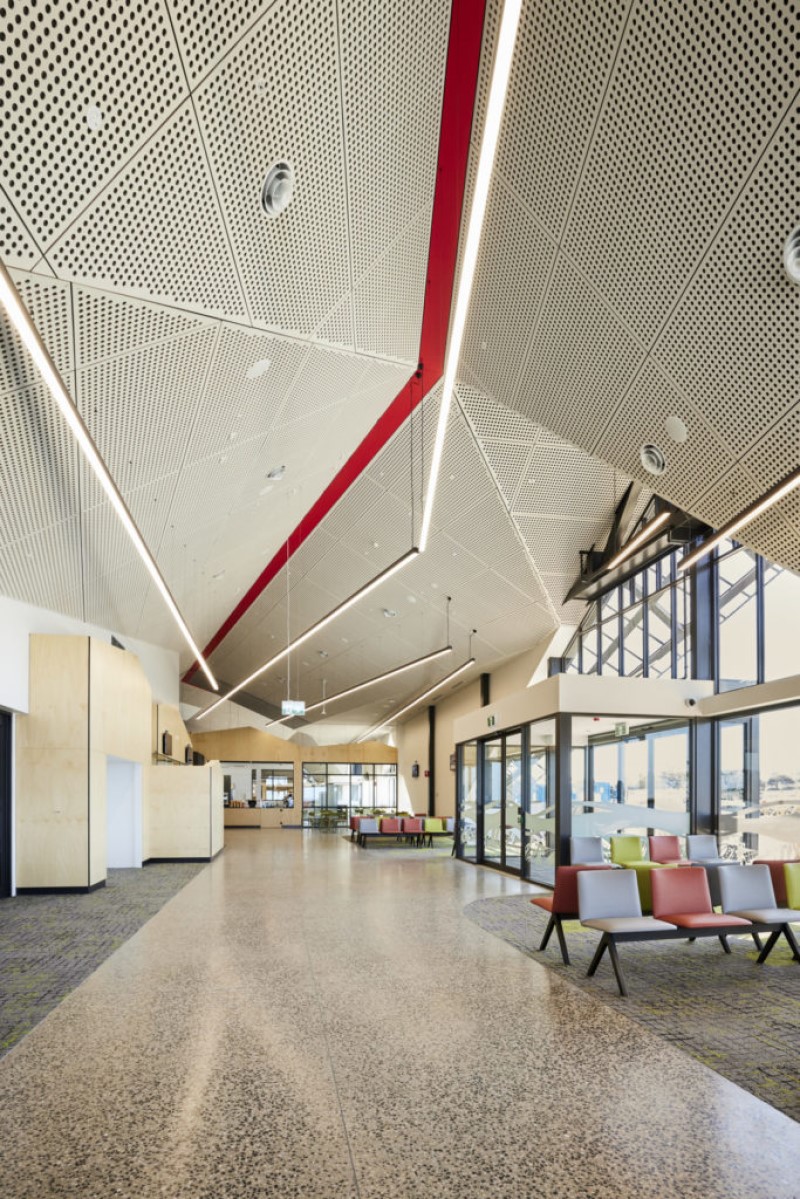 An image of the interior of a building with seating and retail counters, the interior of the new passenger terminal at the $135-million Spirit of Tasmania Quay at Geelong Port in Victoria.