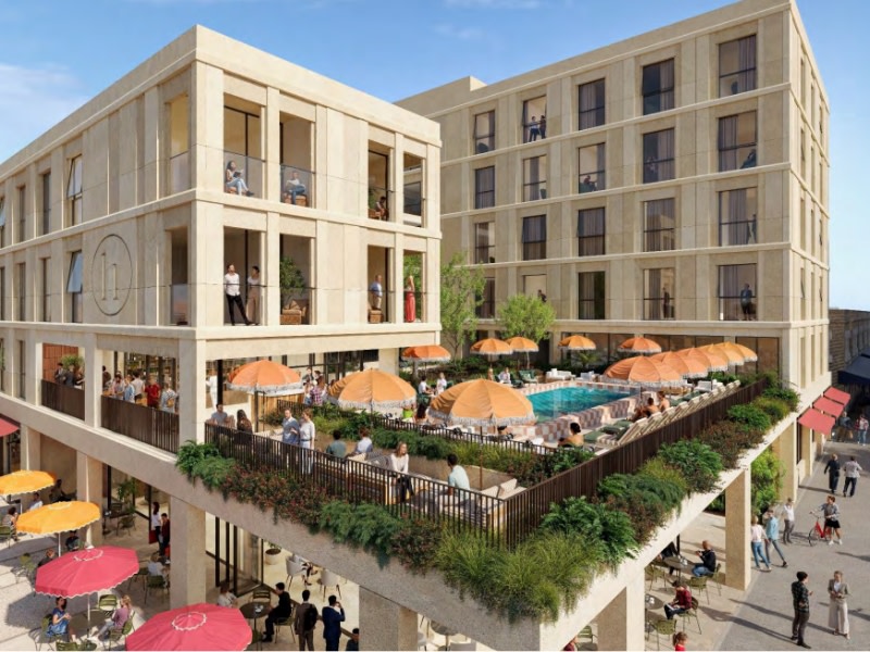 rendering of a peach and white checkered pool surrounded by umbrellas on the podium of a mid rise hotel 