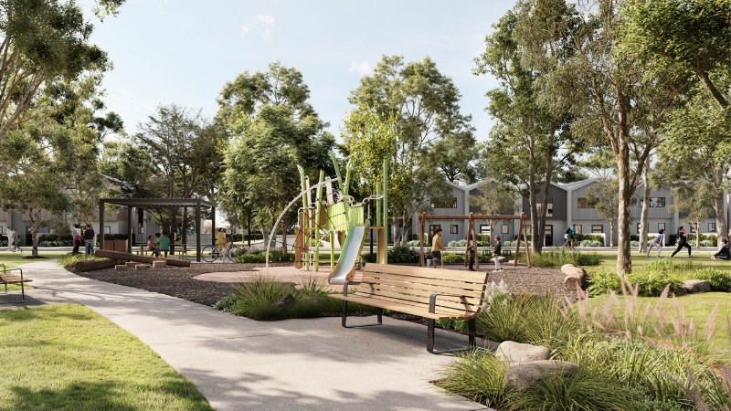 rendering of a playground and fields surrounded by modern homes in victoria.