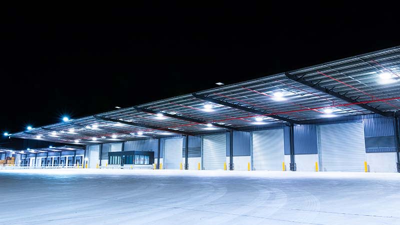 A vacant industrial warehouse at night