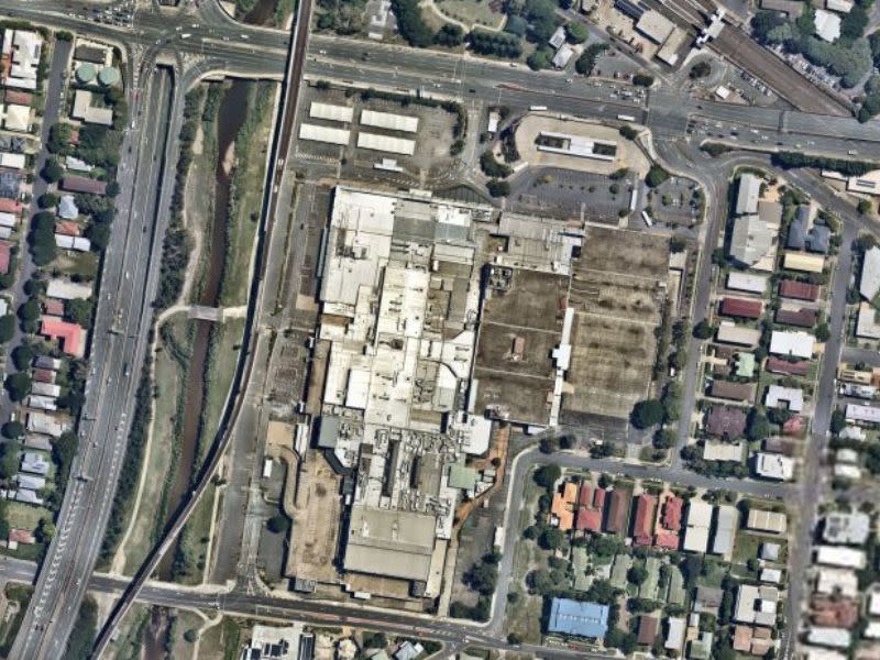 Toombul Shopping Centre aerial image shows an abandoned site and rooftop with lots of pipes and car park spaces.