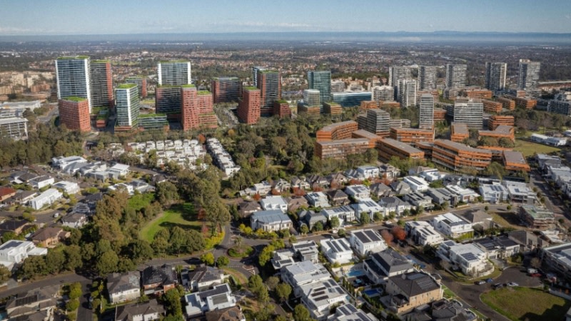 TOD Accelerated rezoning for Kellyville and Bella Vista render of the region between the train line and creek with tall towers and rooftop gardens.