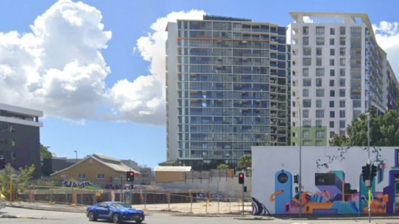 image from the street of an empty block of land in fortitiude valley brisbane, there is some lovely, colourful graffiti artwork on the site. 