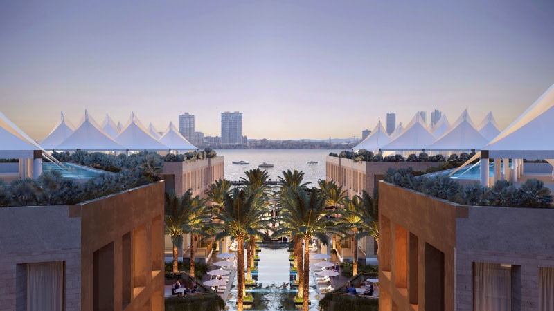 view of the Marina Mirage looking across an open courtyard to the marina at sunset.