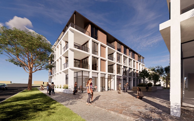 The Bathla Group development in Edmondson Park viewed from the corner shows a courtyard between four storey residential buildings with a cafe on the ground level. Image: Rothelowman