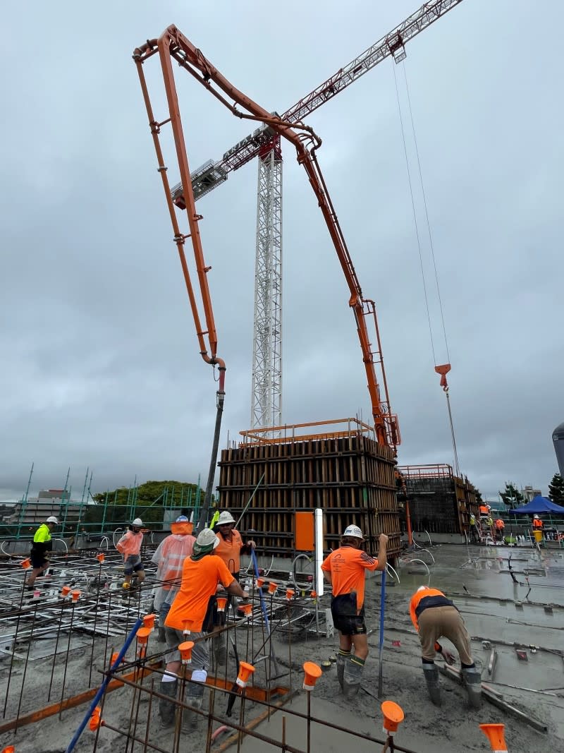 Workers back on site after Riviere Constructions was formed, to pour the first concrete slab on 28 March. Source: Aria Group.