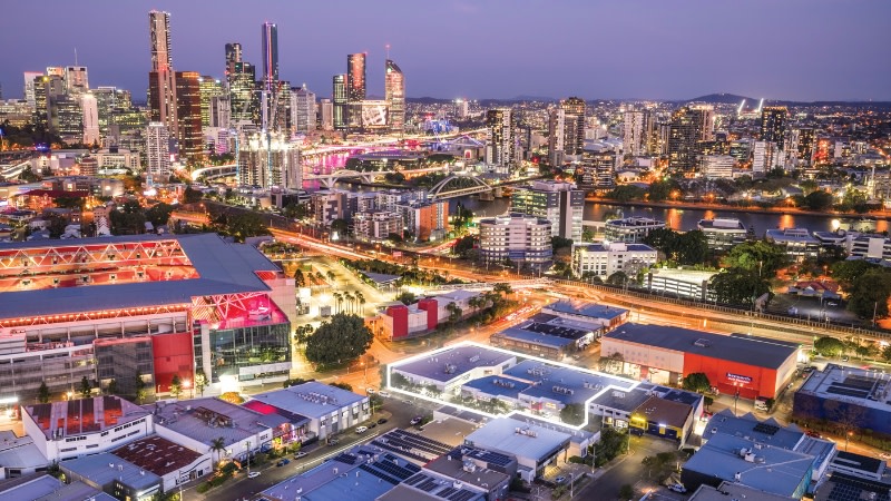 a three storey office building next to suncorp stadium in Brisbane at night