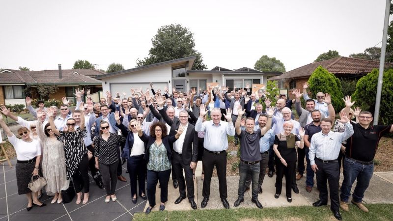 Property Industry Foundation's partners and collaborators celebrating the opening of a new home.
