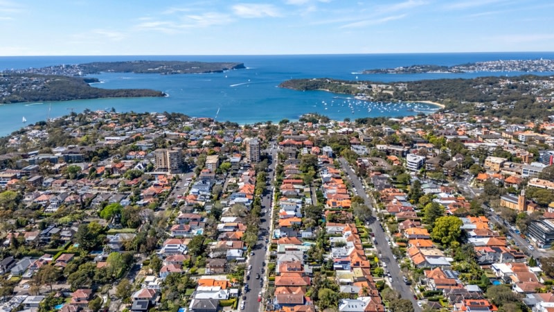 drone image showing different height buildings in mosman looking out to the water.