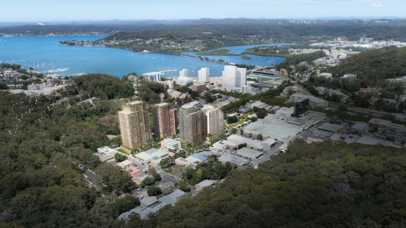 drone image looking at Gosford from the hills down to the coast past several new developments.