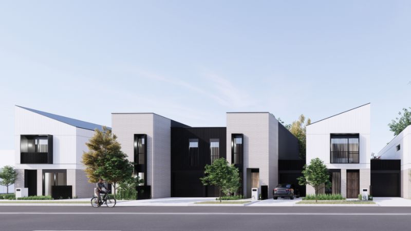 Image of townhouses with a modern finish. The render is of angular homes which are two storey.
