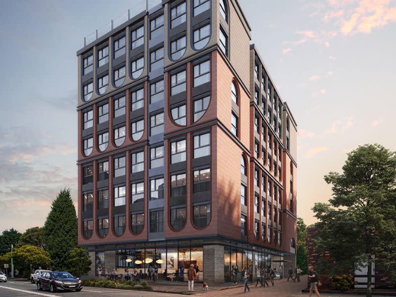 render by COX Architecture of the exterior of the co living building called Rockdale Residences with inverted arches and red brick finishes.