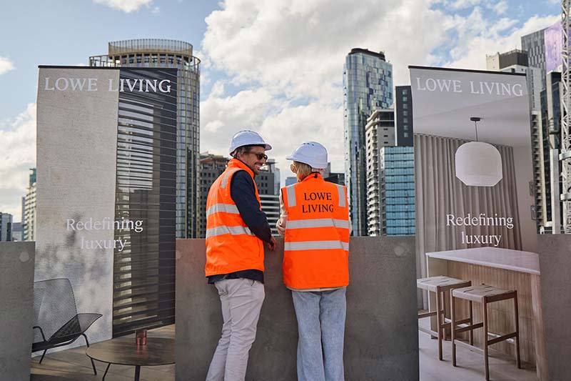 The husband-and-wife team, Emma and Tim Lowe, celebrate structural completion of their 36-apartment Emerald Place precinct