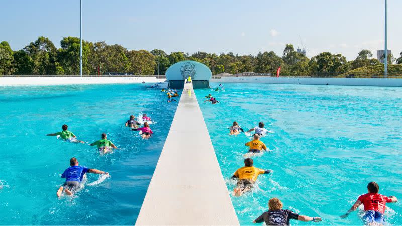 Surfers take to the waves at URBNSURF Sydney for the 10-year anniversary of Wipeout Dementia