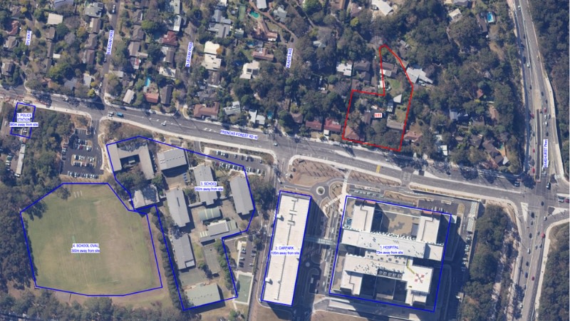 aerial of the Frenchs Forest hospital which is next to a school and surrounded by low density residential. 