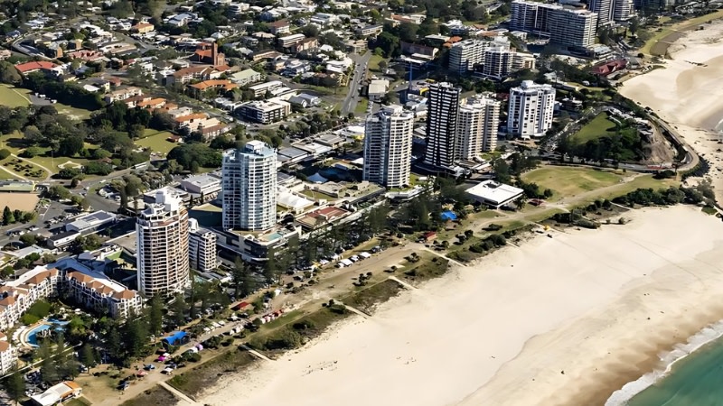 drone image showing the strand shopping centre opposite coolangatta beach