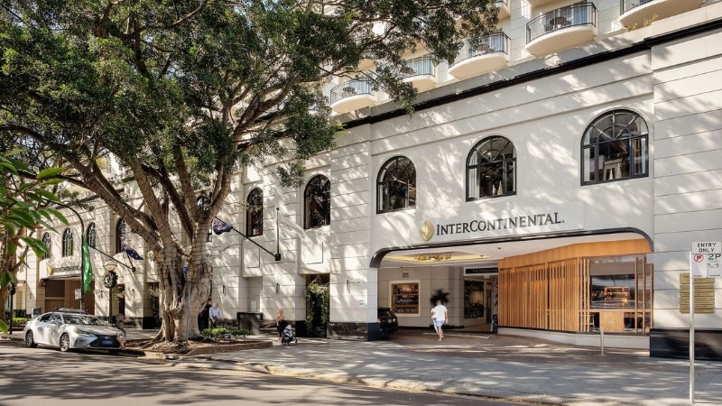 the front of the Intercontinental Sydney Double Bay, a white hotel with a luxurious classic entrance.