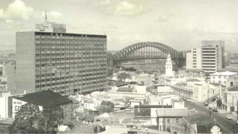 a black and white image of the commercial MLC Building and Sydney Harbour Bridge