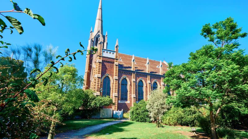 The Uniting Church in Australia on the sale of 579-599 Queensberry Street & 51-61 Curzon Street, North Melbourne. Image of a 170 year old church on a large site on a sunny day.