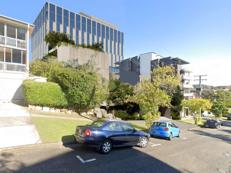 rendering of the rear of a 10 storey health building between a house and apartment complex.