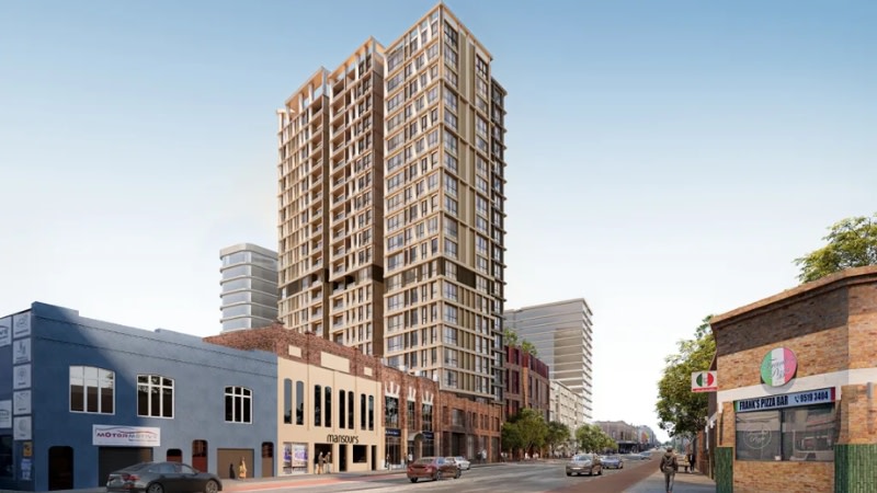 rendering of a 21 storey tower lined up between the 2-storey shopfronts in annandale 