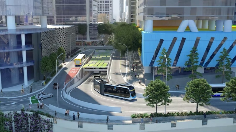 Artist impression of a Brisbane Metro electric bus emerging from a city tunnel, with an older bus on the ramp.