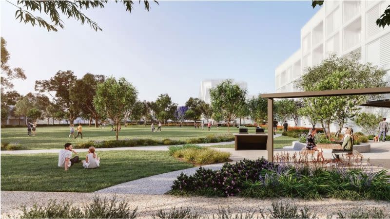 A concept rendering for the Hampton Barracks redevelopment showing an outline of an apartment building beside a big park.