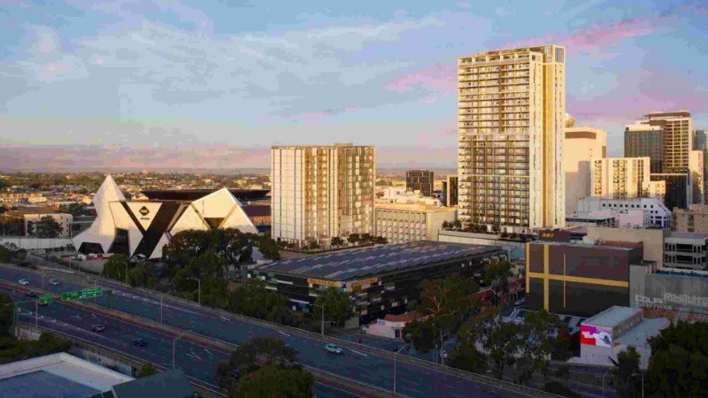 rendering of two new towers in a drone image looking at the RAC Arena and hotel with the Perth city behind it.