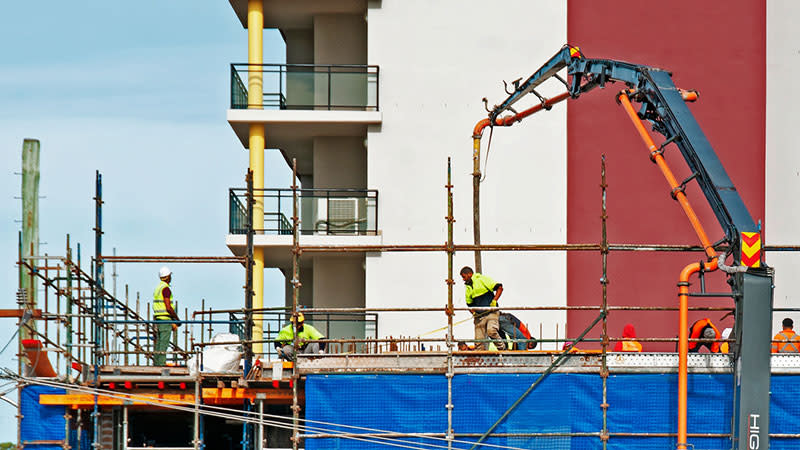 Contractors working on an apartment project job site