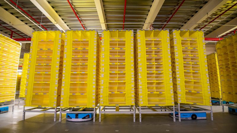 The yellow robotic shelves operated by Amazon are ready for new stock. 