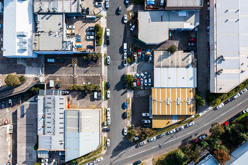 Aerial View of an Industrial Zone with factories and warehouses MID