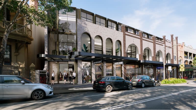 a reimagining of the Hills Buildings in Surry Hills, the shopfronts have archways and one of the shops has been turned into a lobby and end of trip facilities. 