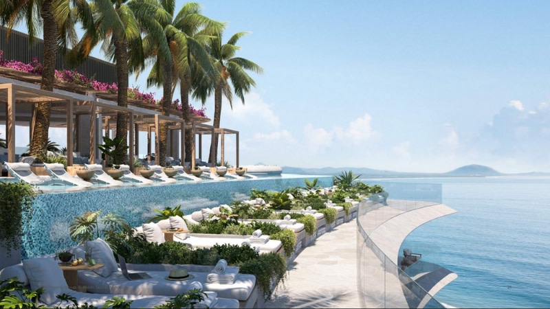 rendering of a swimming pool and deckchairs on a hotel next to the beach