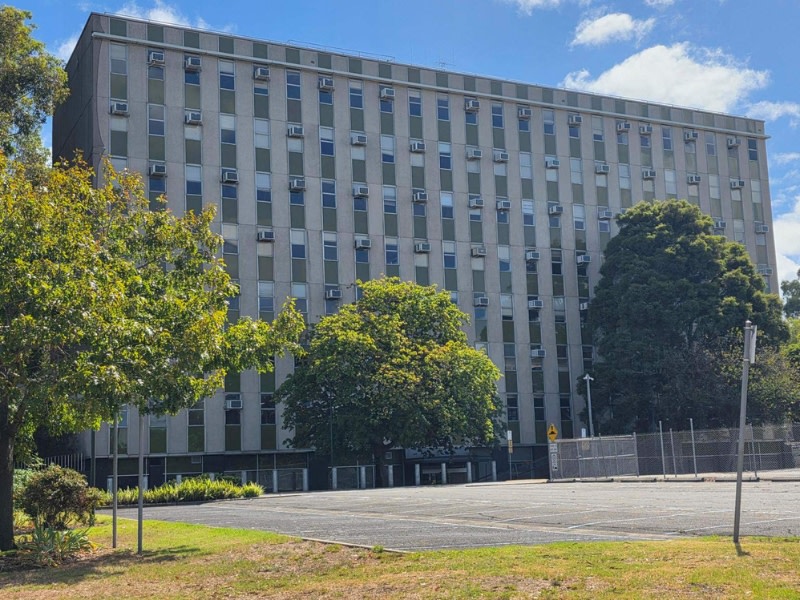 image of a 1960s building in kew with air conditioning units sticking out from every other window