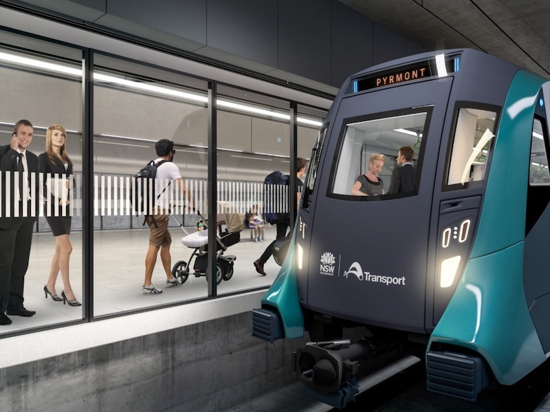 An image of a train platform with glass doors separating the platform from the track: a render of one of the platforms at the proposed Pyrmont Station on the Sydney West Metro line. 
