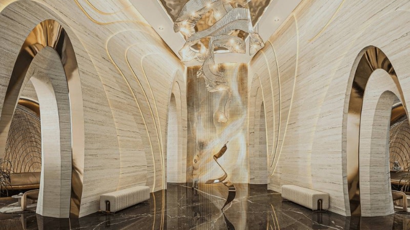 a gold, sand and white coloured hotel lobby with black marble floors