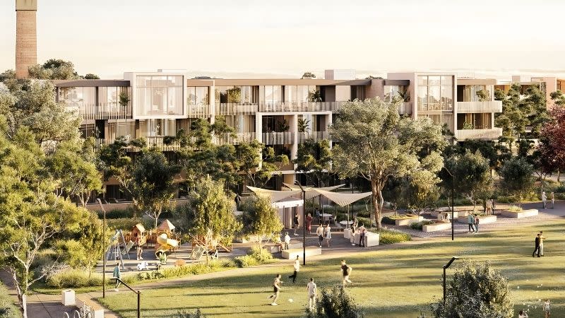 DKO Architecture’s midrise apartments overlook the masterplanned central park at The Works Corrimal, with retained industrial chimneys visible.