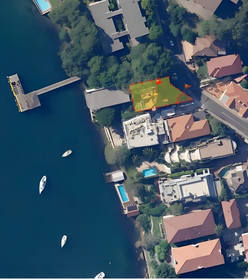 An aerial view of the 115 Kurraba Road site, shaded, above Neutral Bay and beside the public accessway to Kurraba Point Wharf.