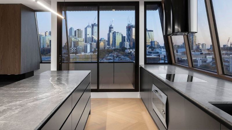 Modern apartment kitchen in a city tower built with Procore Technology.
