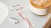 Venus Deluxe Smooth Sensitive Rosegold razor in the bathroom and its refill next to it