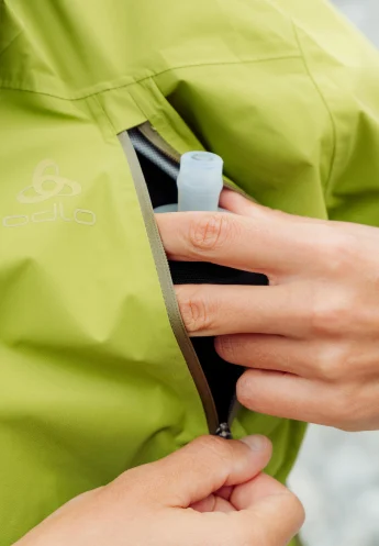 The X-Alp Pro 2.5L waterproof jacket- Zippered hand pockets- feature SS26