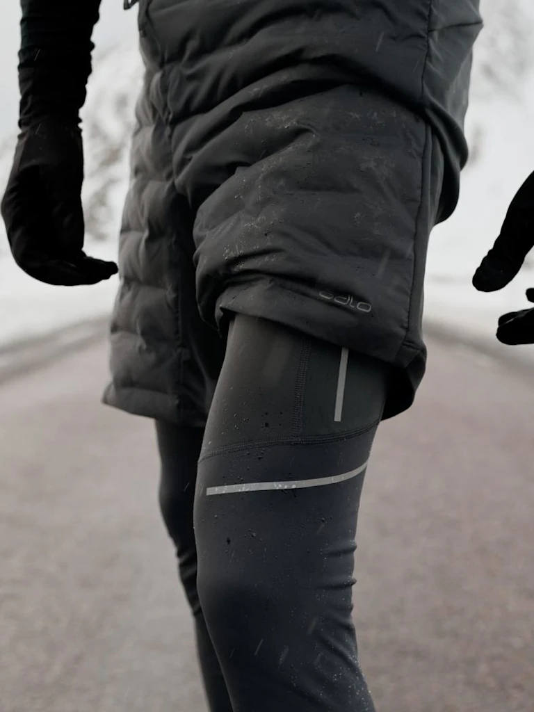 FW26 Road Running men in Zeroweight running tights and Zeroweight insulated shorts in black
