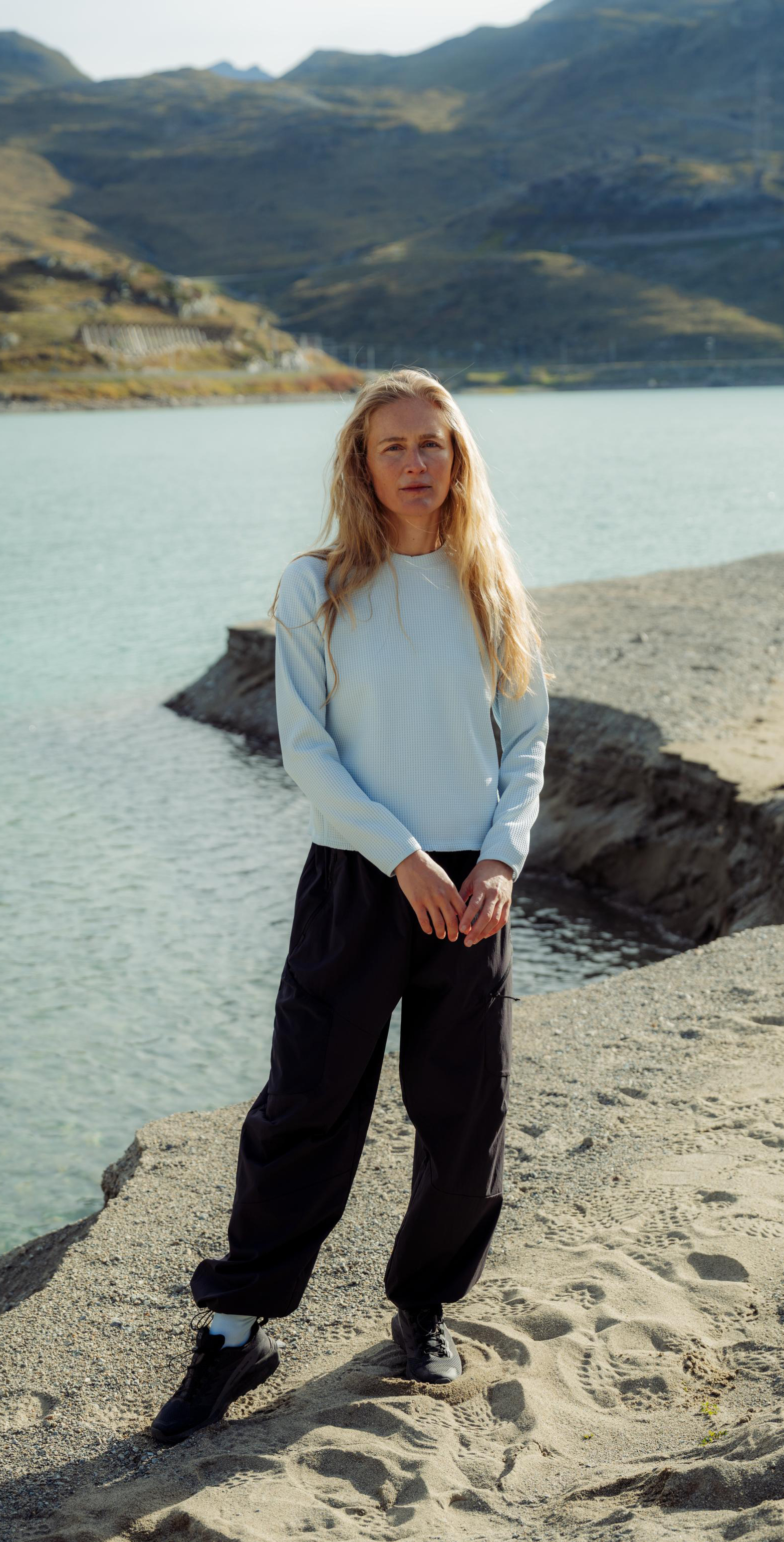 SS26 Hero Mid Layer Guide women outdoors wearing light blue cubic 