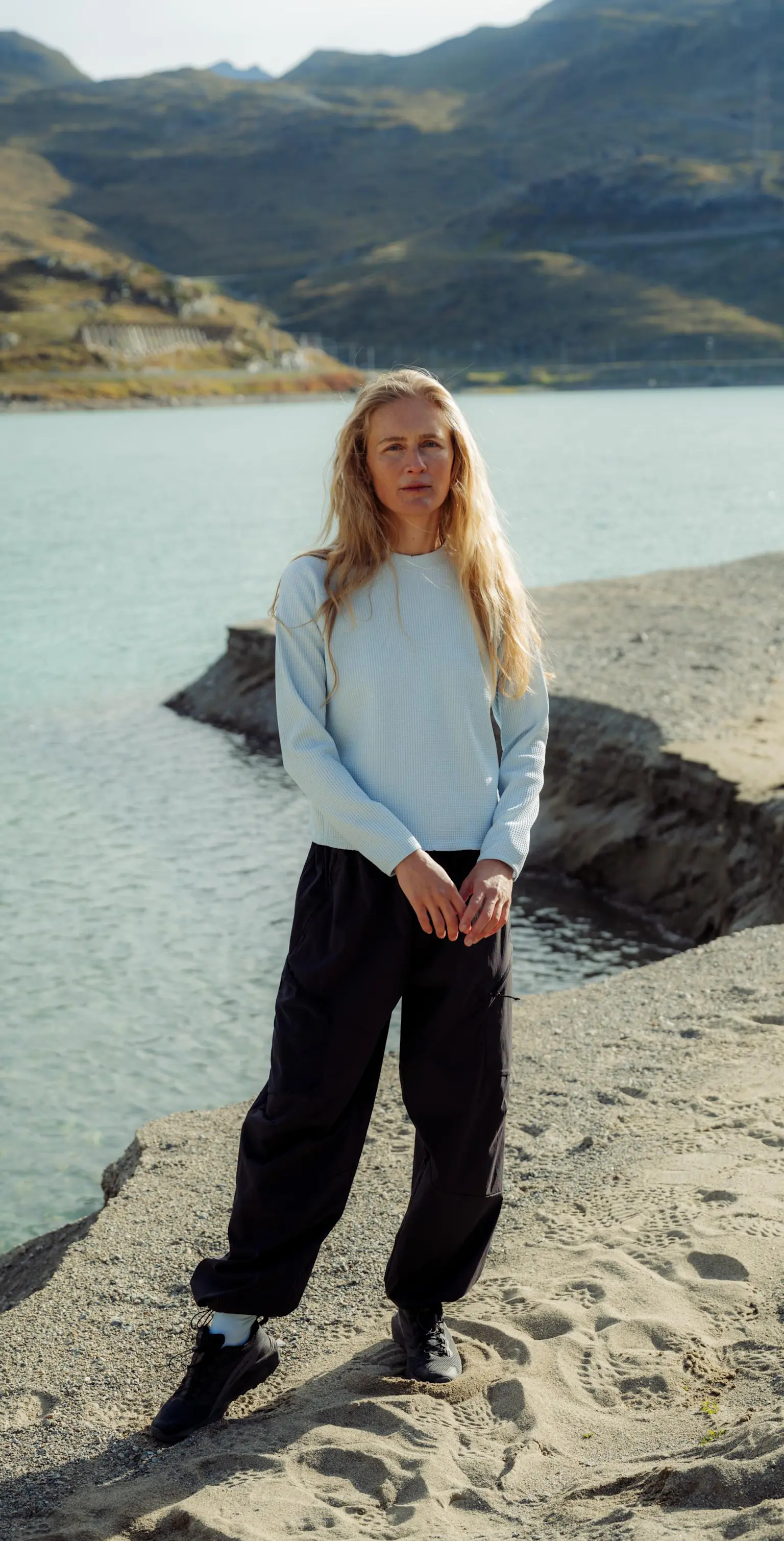 SS26 Hero Mid Layer Guide women outdoors wearing light blue cubic 