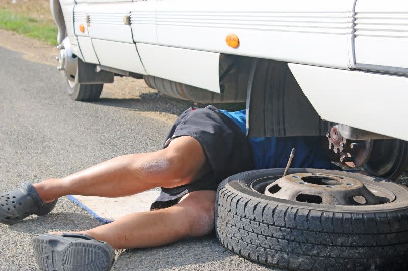 person-doing-maintenance-on-rv.jpeg