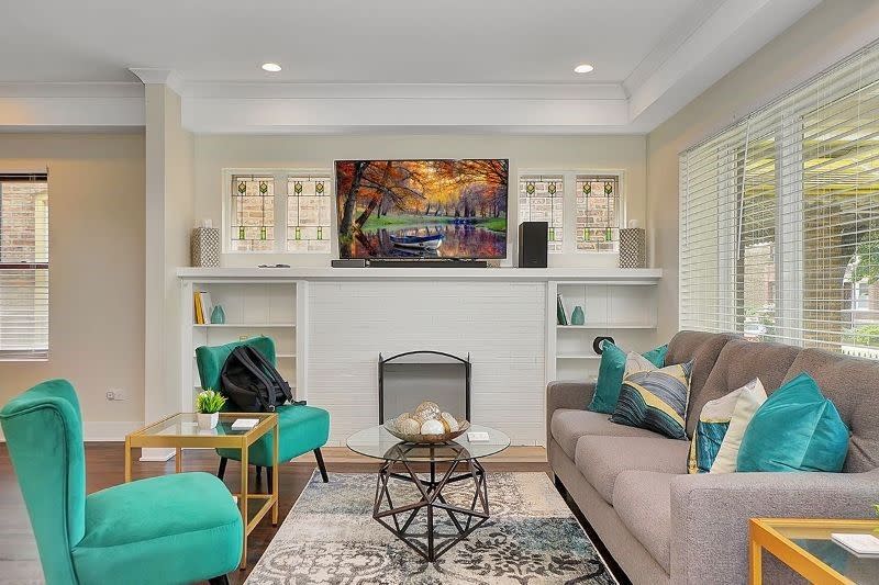 living-room-teal-armchairs-beige-couch.jpeg