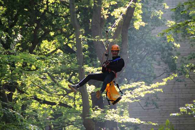 Gresham's School - student at the Outdoor Activity Center hanging on the High Ropes Gresham's School - student at the Outdoor Activity Center hanging on the High Ropes